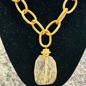 Susan Shaw Chic Gold Necklace with a gold large stone.